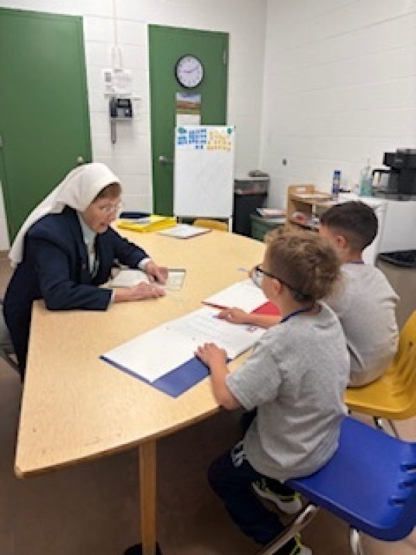 kids talking to a nun
